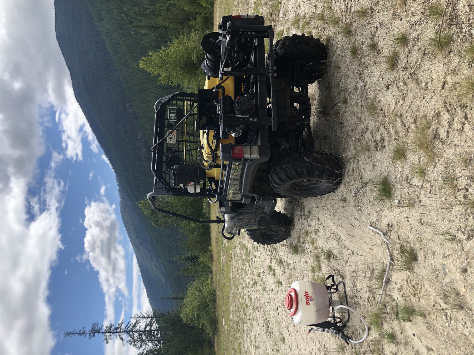 ATV spray rig and backpack sprayer on a rural mountain property